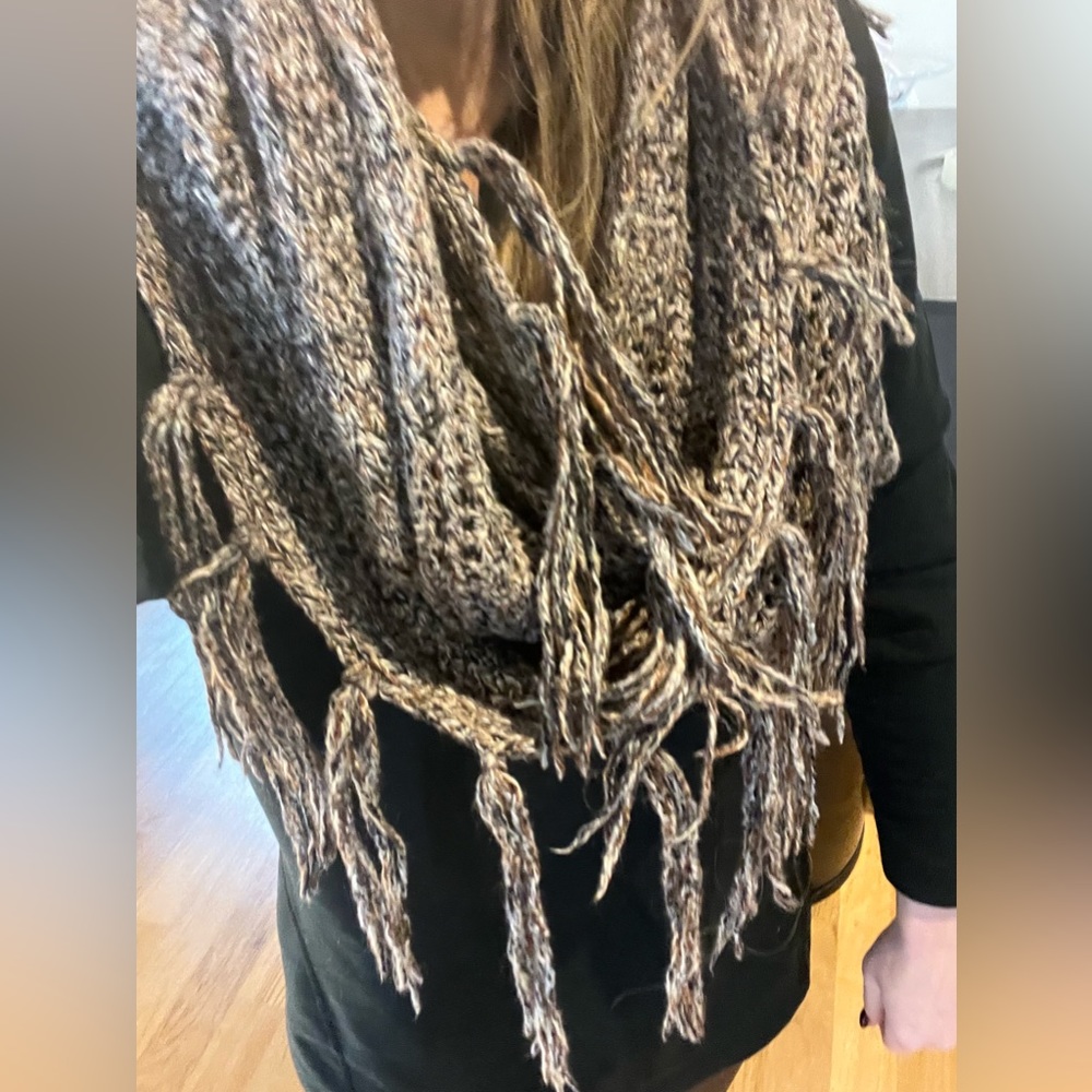Collection Eighteen Infinity scarf knitted with fringe.